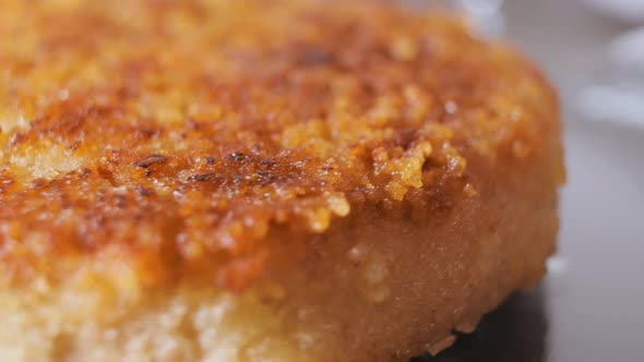 Cutlet Closeup in Golden Crispy Breading with Smooth Camera Movement alt