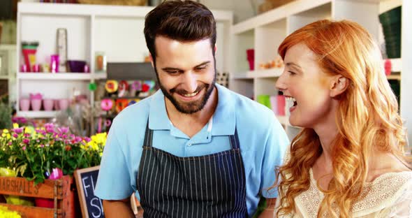 Florists giving high five to each other alt