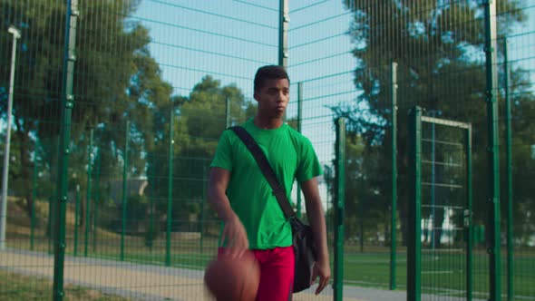 Streetball Player Going To Play Basketball on Court alt