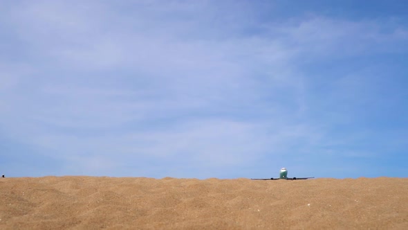 Superslowmotion Shot of a Tropical Beach Where Airplanes Fly Over Tourists Heads Before Land alt