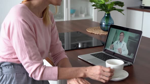 Middle Aged Female Patient Getting Online Telemedicine Consultation at Home alt