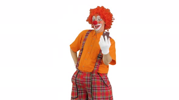 Clown Taking Selfie with His Phone on White Background alt