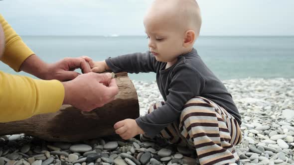 Father and Little Son Spend Time on the Beach alt