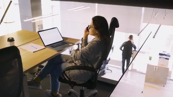 Lady with Glasses Use Smartphone on Workplace