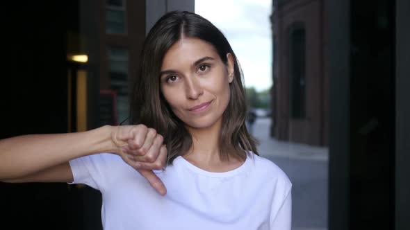 Thumb Down by Unhappy Beautiful Female Designer alt