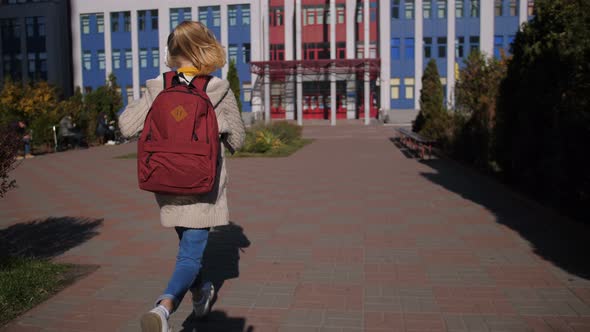 Cheerful Middle School Girl Running To Lessons alt