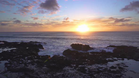 Sunset over Ocean Coast in Summer Evening New Zealand alt