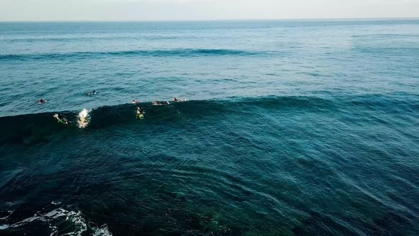 surf spot with active men surfers and waves from ocean power - vacation scenic place alt