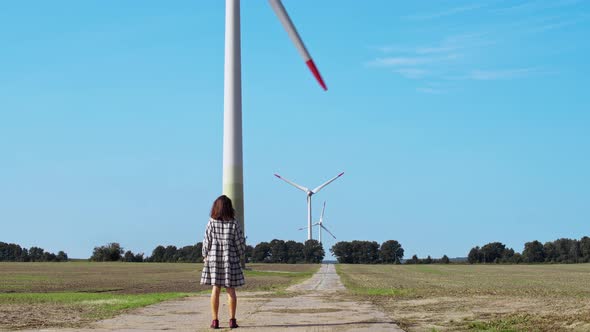 Woman Look At The Wind Turbines