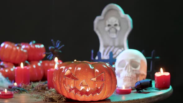 Flashing Red Lights Over a Still Life Halloween Decorated Table alt