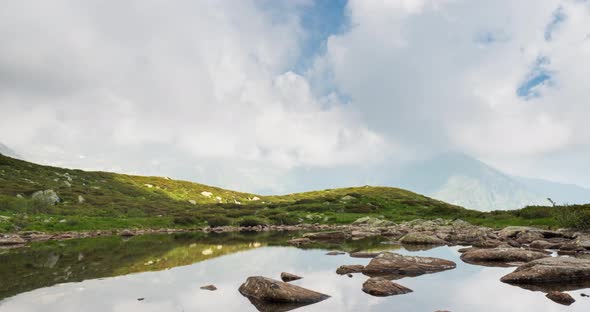 Timelapse of Mountain Lake Landscape with Clouds at Poggio Frassati in Biella Piemonte Italy alt