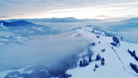 Aerial View in Foggy Sunset Winter Mountain alt