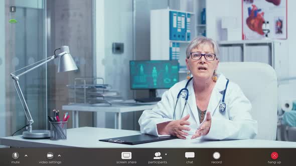 Doctor Making an Online Consultation Footage with Software Overlay alt