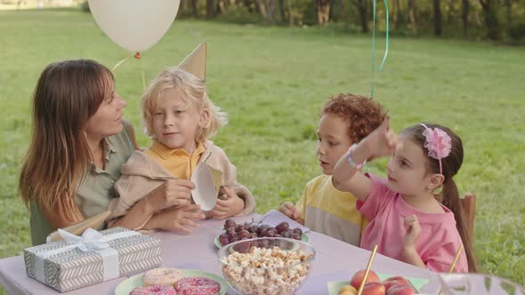 Woman with Kids on Birthday Party alt