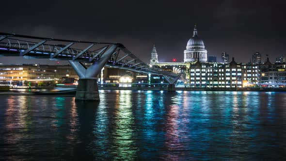 London Millennium Bridge and St. Paul's Cathedral with night illumination alt