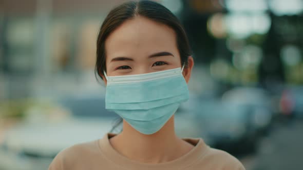 Young Attractive Asian woman wearing medical mask