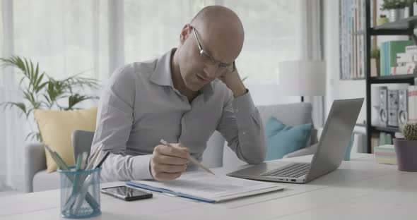 Frustrated businessman working from home