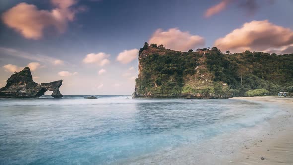 Pictorial Rocky Cliffs of Atuh Beach at Calm Ocean