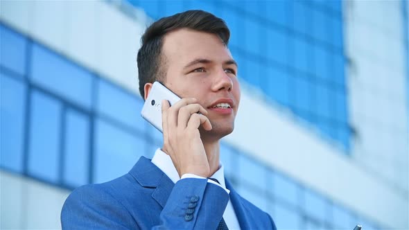 Young Businessman Talking On Mobile Phone