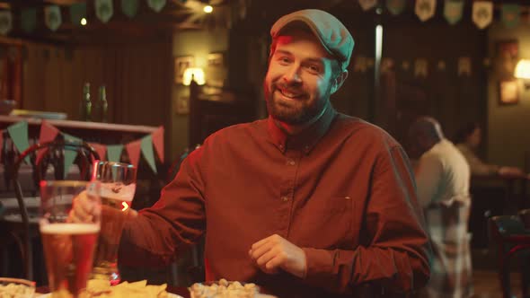 Man Enjoying Beer In Pub alt