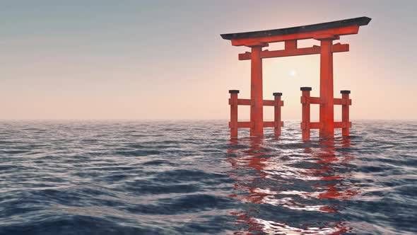 Traditional Japanese gate floating in the sea at sunset