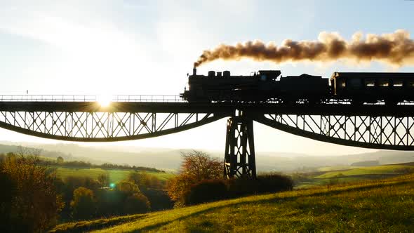 Historical Steam Engine Train Riding on Railroad alt