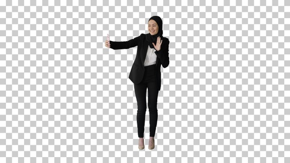 Smiling Arab woman in hijab taking selfie, Alpha Channel alt