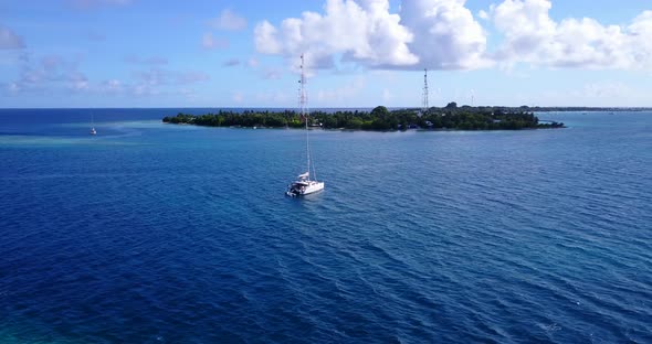 Beautiful birds eye tourism shot of a summer white paradise sand beach and blue ocean background in  alt