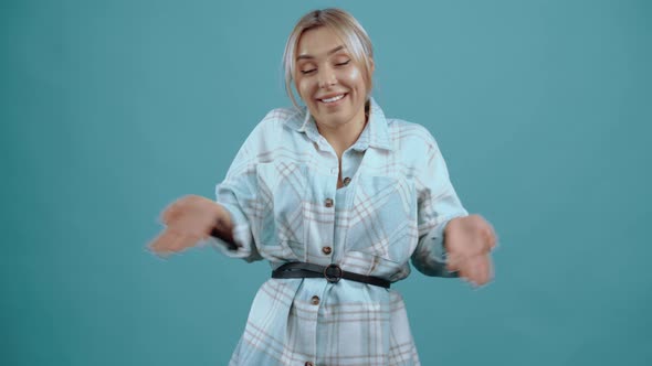 What the The Young Woman Who Looks Into the Room Shrugs As a Negation Shaking Her Hands alt