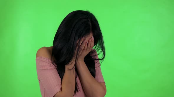 Young Attractive Asian Woman Cries - Green Screen Studio alt