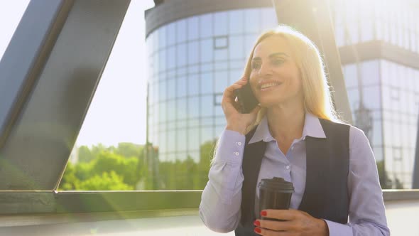 Portrait of Happy Senior Business Woman Calling Phone Outdoor alt
