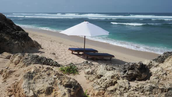 Beach Chair and Umbrella on Tropical Sand Beach