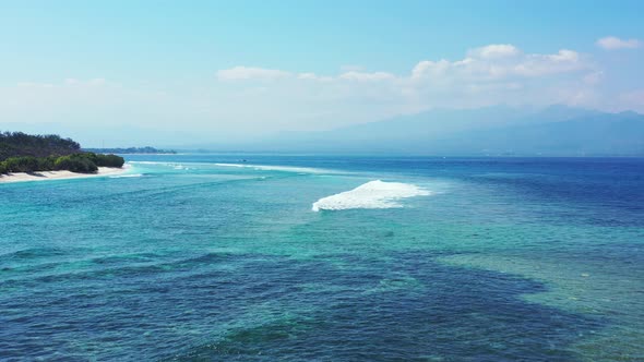 Tropical overhead tourism shot of a sandy white paradise beach and blue sea background in best quali alt