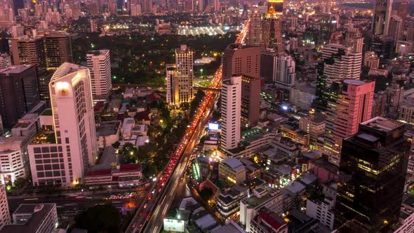 Traffic during rush hour, day to night, Bangkok business district city center, zoom out – Time Lapse