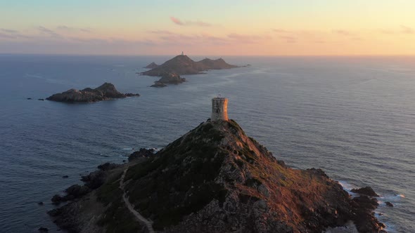 Aerial View Lighthouse on Mountain Rocky Hill in Sea Sunset alt