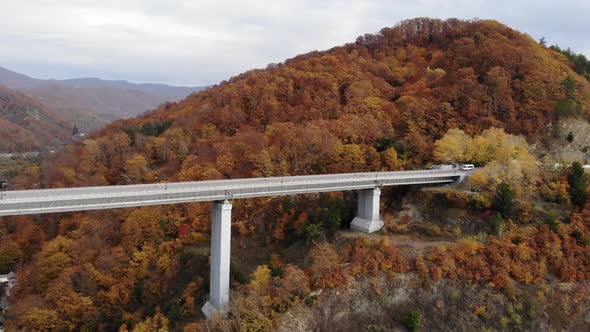Aerial View of the Highway Viaduct on Concrete Pillars in the Mountains, Flight Over Autobahn alt