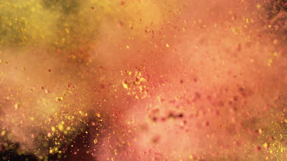 Powder exploding against black background. Slow Motion. Unedited version included. alt