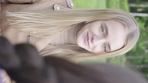 Vertical Video of a Young Skinny Girl in the Park alt