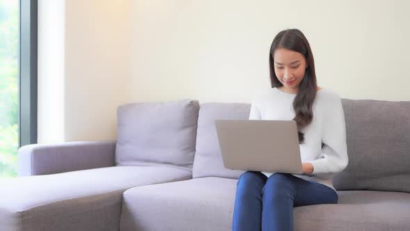 Young asian woman use laptop