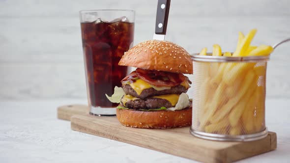 Fresh Tasty Burger Served with Soda and French Fries on White Table alt