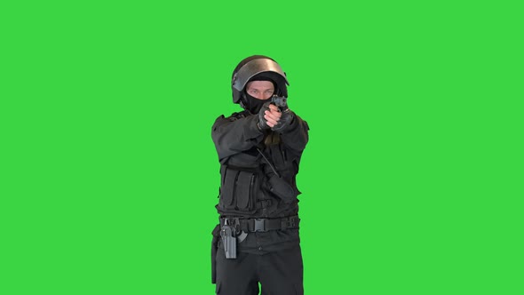 Police Tactical Unit Aiming with a Hand Gun on a Green Screen Chroma Key alt