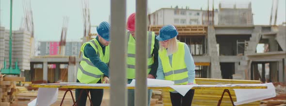 Engineers Checking Blueprints alt