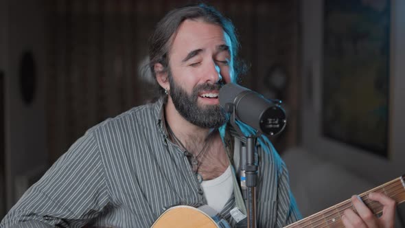 Man Singing Standing in a Home Studio alt
