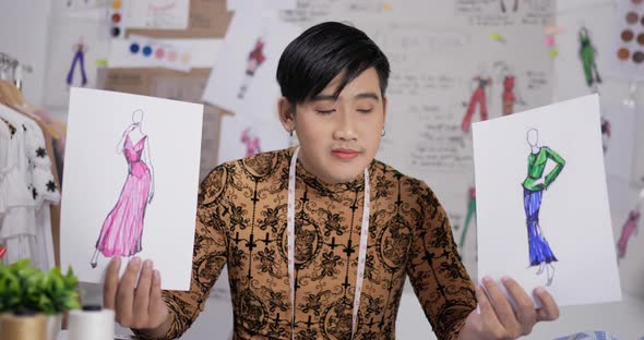 Fashion designer man showing a sketch of clothing alt