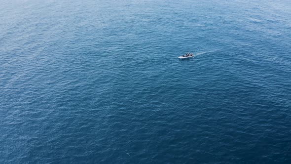 Aerial view of a motorboat in the ocean, Azores, Portugal. alt