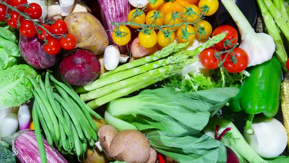 Assortment of Fresh Organic Vegetables. Away from a Close-up to Wide Shot. alt