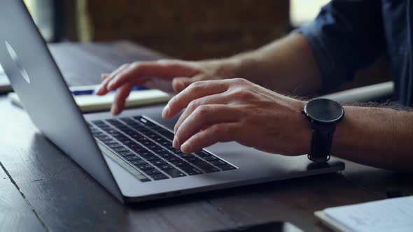 Closeup Caucasian Male User Hand Typing on Laptop Keyboard Sit at Table alt