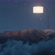 Cozy Bed Illuminated By Lamp. The Bed Flying Over Fluffy Clouds At Night - VideoHive Item for Sale