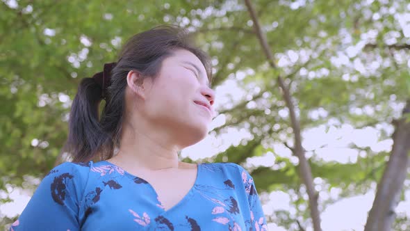 asian female casual cloth smile with freshness happiness wellness freedom standing and breathing alt