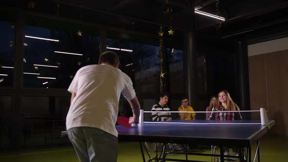 Smiling Woman Playing Table Tennis in Wheelchair alt